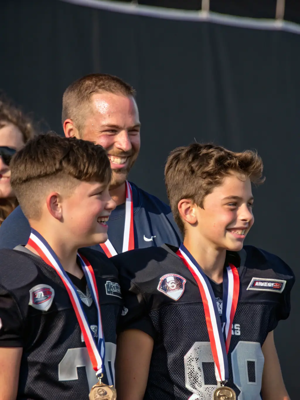 A child receiving a sportsmanship award at a ASSOCIATION SPORTIVE DE BOIVRE event, highlighting personal development and recognition.